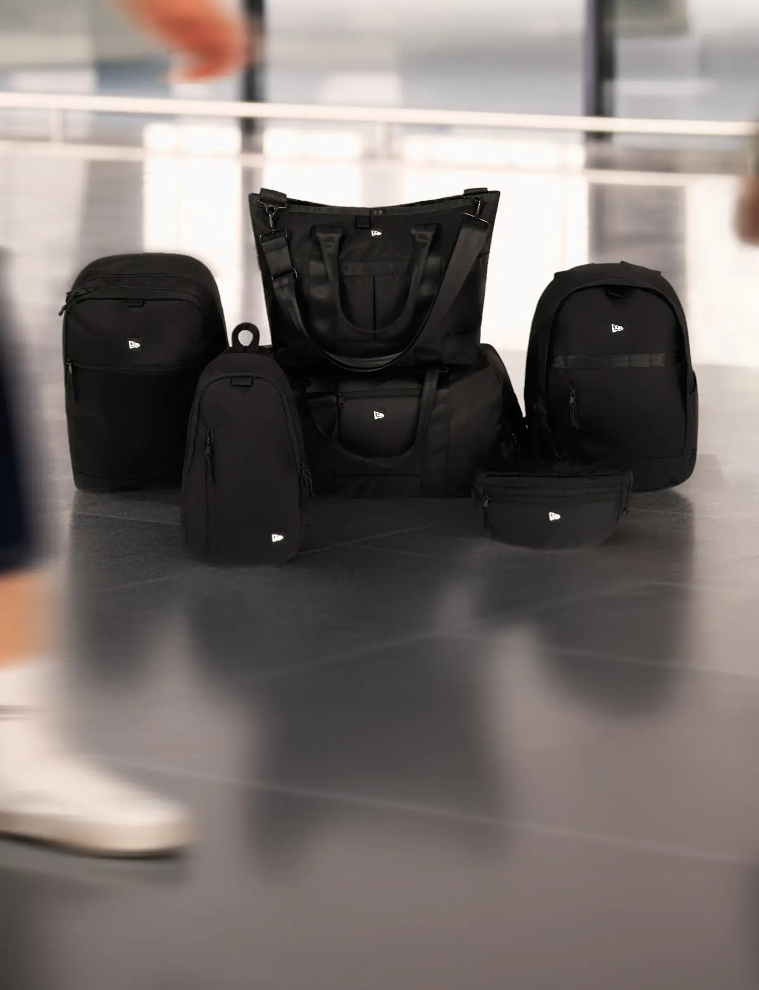 New Era premium accessories in airport setting 