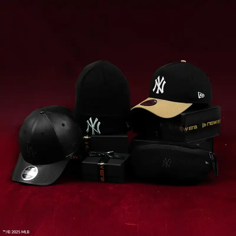 Two black baseball caps with a logo on a red background, featuring MLB branding.