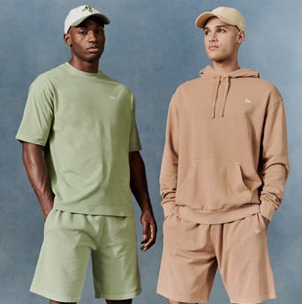 two men wearing new era's pastel apparel collection