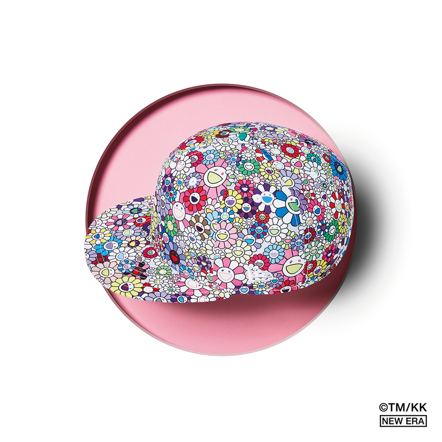 White flower Takashi Murakami x New Era cap with pink background