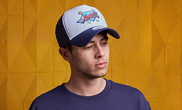 Man wearing a New Era Trucker cap
